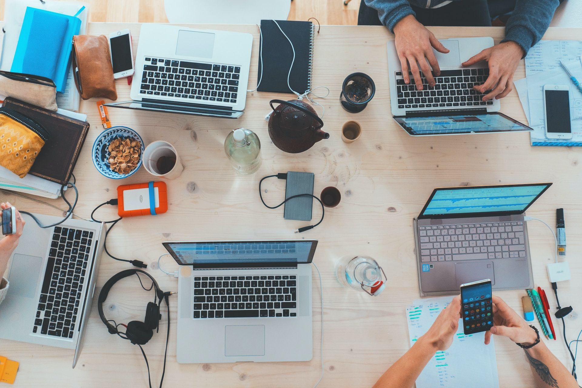 colleagues working together on a workstation